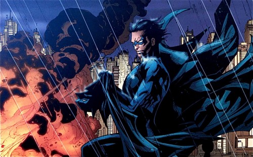 nightwing holding batmans cape