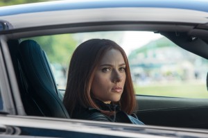 Black Widow in a sports car