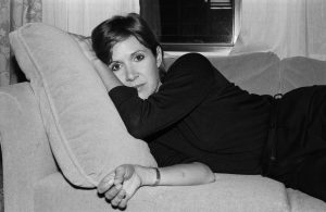 Carrie Fisher on a couch