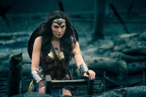 A Supermodel Cosplays as Wonder Woman on a ladder