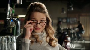 Supergirl looking over her glasses