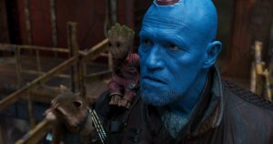 Yondu and Baby Groot with a trash panda in the background