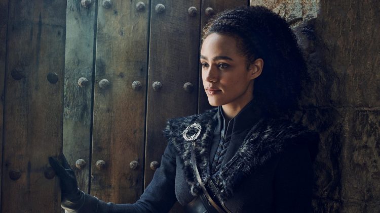 Missandei holding the door open