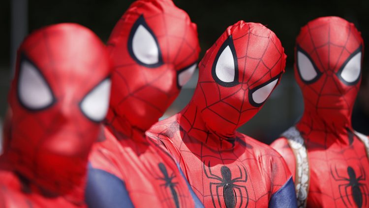 four spider cosplayers